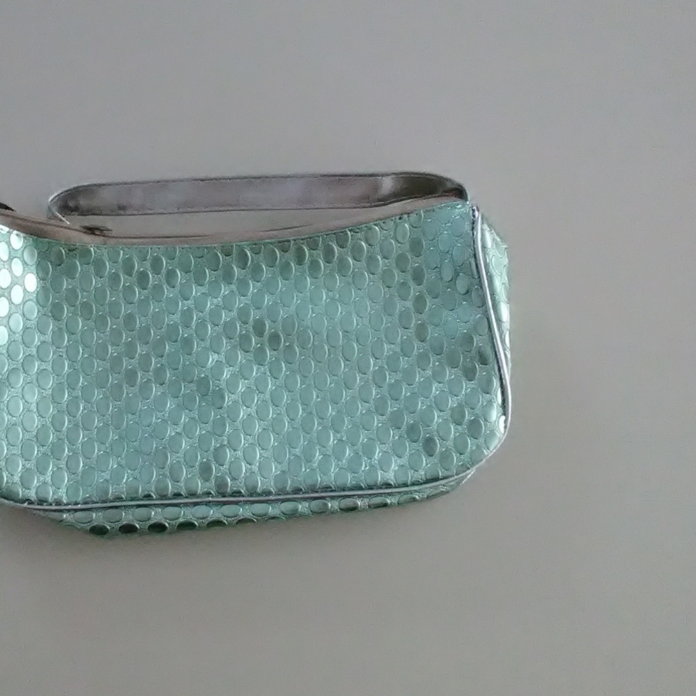 Clutch size strappy bag